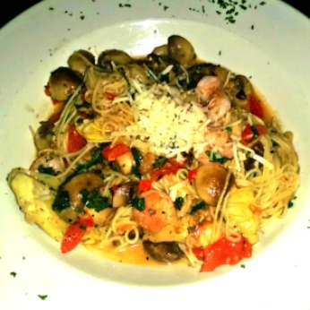 Capellini gamberetti. Angel hair pasta with shrimp, mushrooms, artichokes, and tomatoes tossed in asiago cheese.